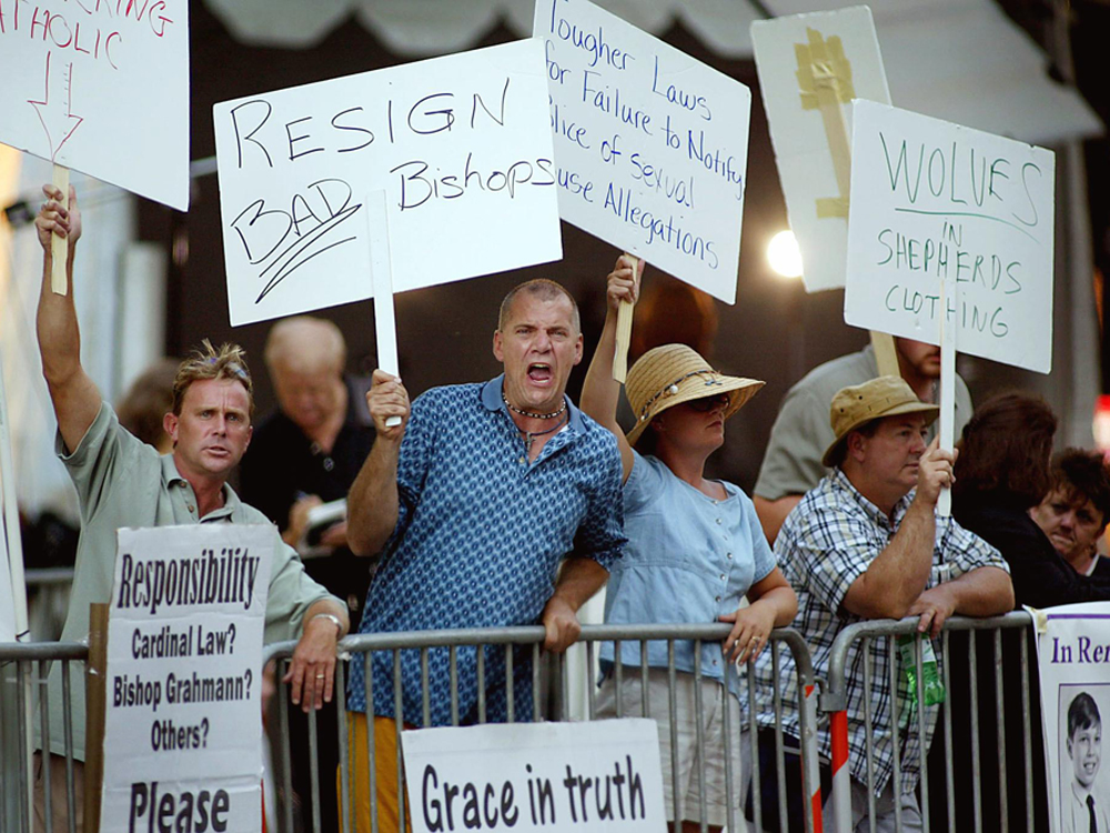 Demonstrators gathered outside the hotel in Dallas where the U.S. Conference of Catholic Bishops were meeting in 2002 to address the scandal.