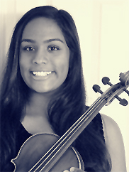 Amrita Mohanty smiles for the camera with her beloved violin just before she performs a solo recital at Central Park in Woodbury in December 2012.